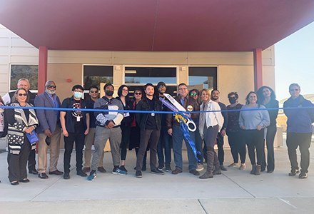 Staff and Students cut a ribbon in front of the MESA STEM Academic Success Center.